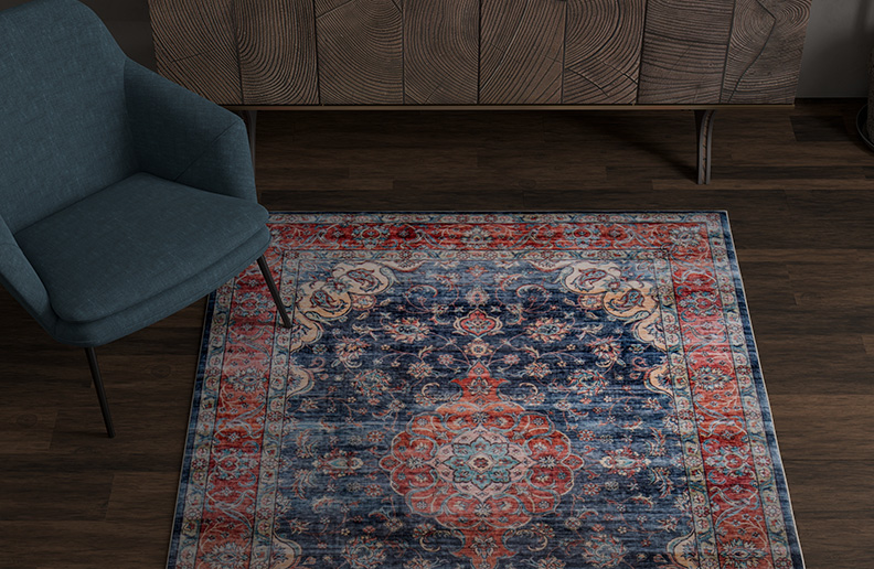 traditional red and blue rug on dark wood floor
